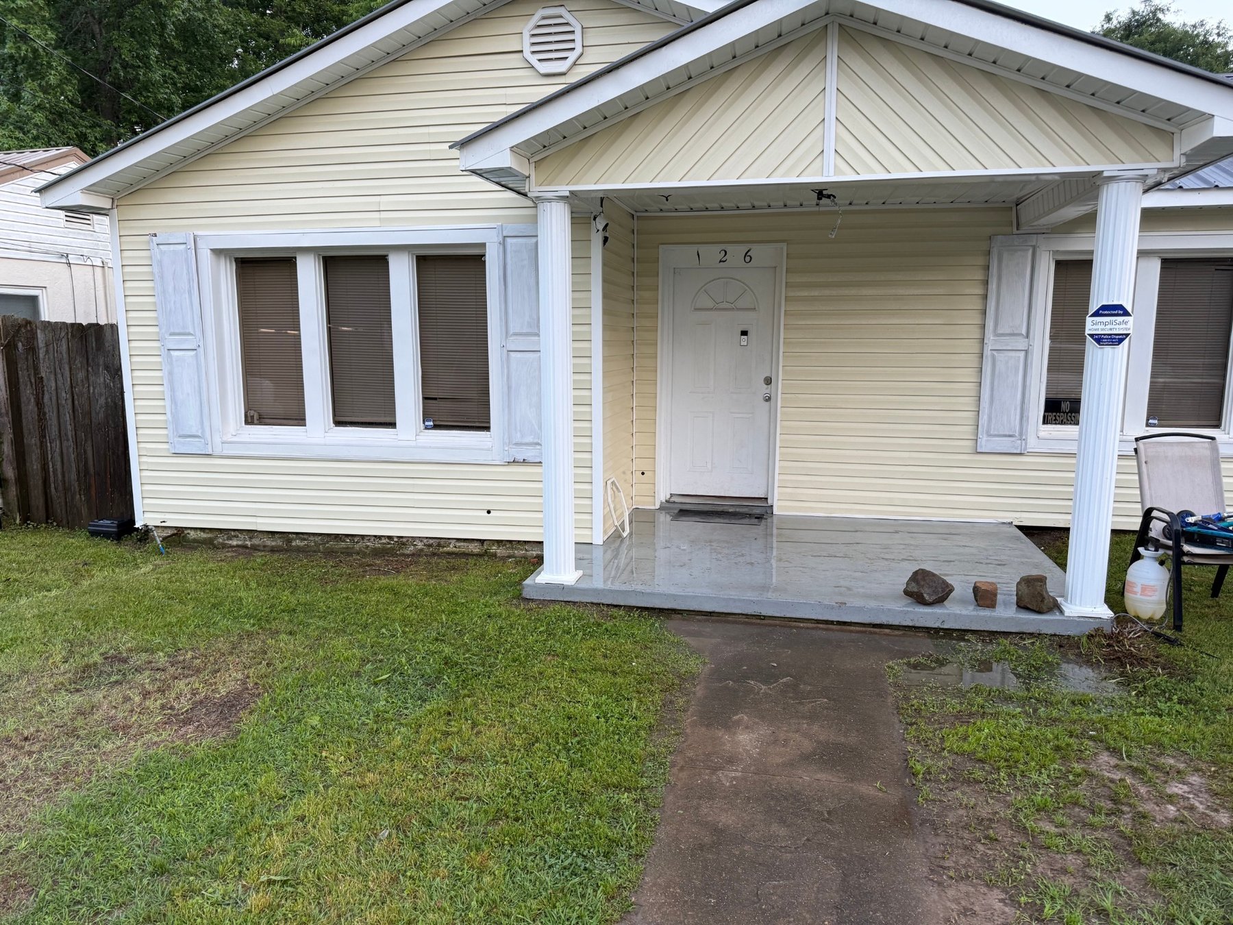 After - Front exterior siding and porch area cleaned