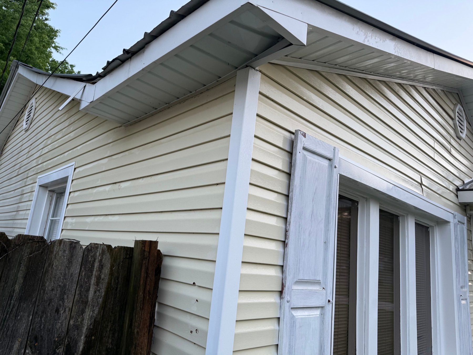 After - Side exterior cleaned with siding and trim brightened