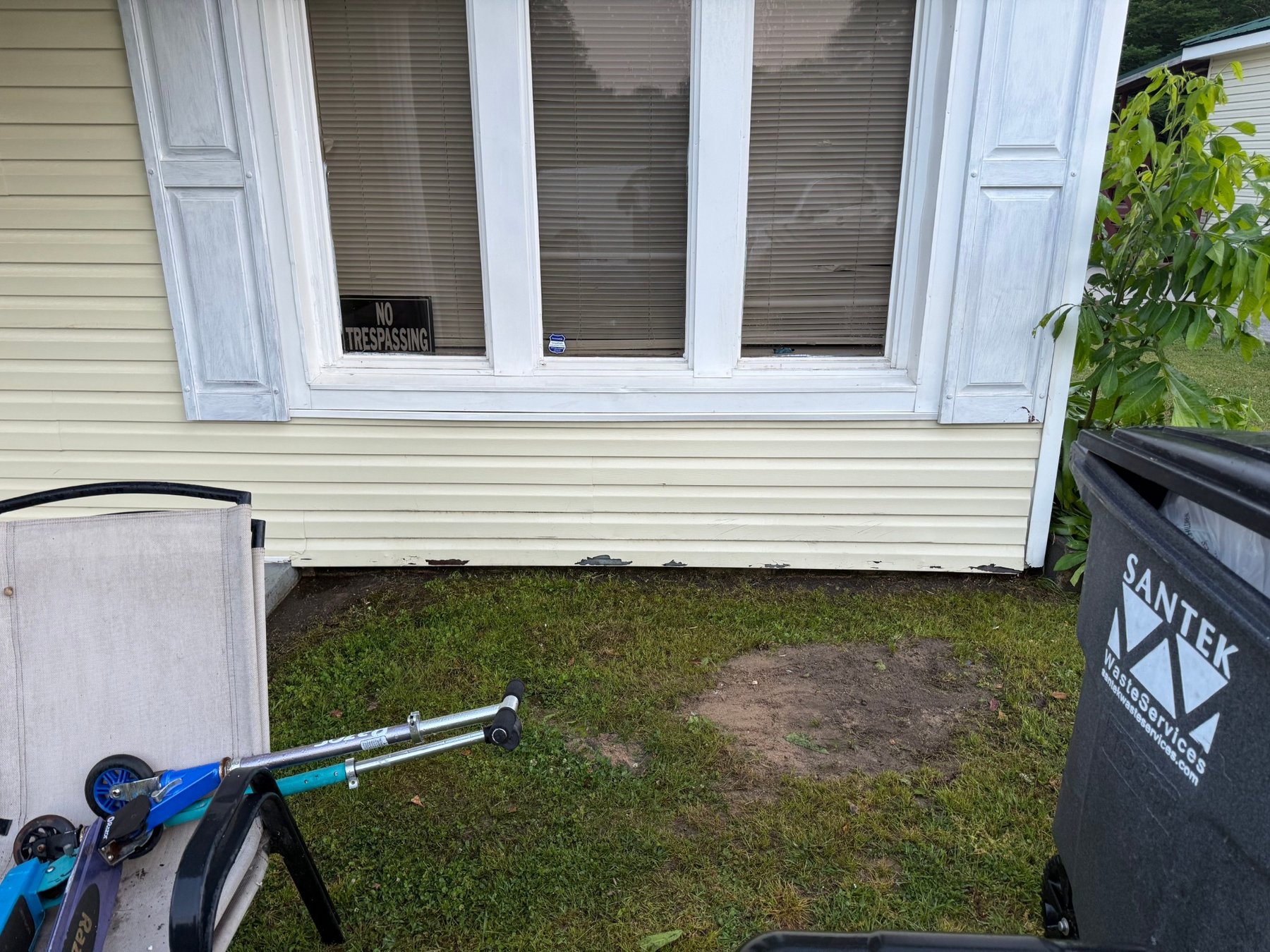 Before - Lower siding area with dirt and surface buildup before cleaning
